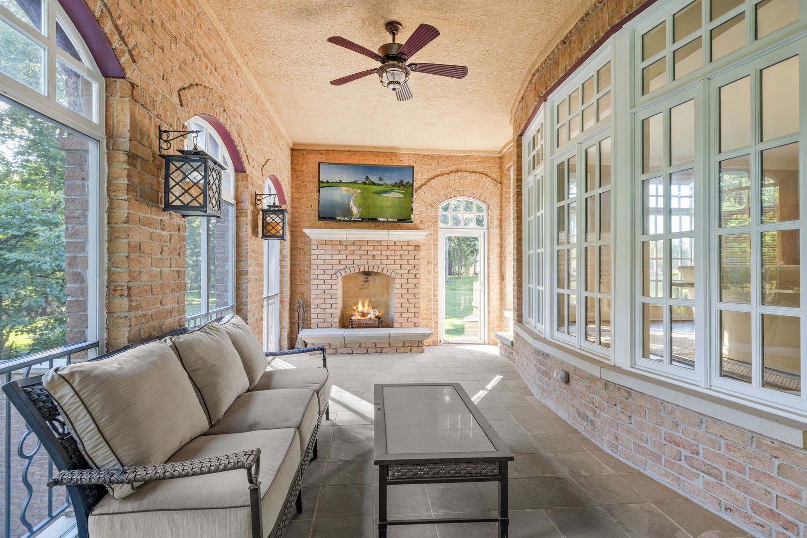 5021 Minkler Road Yorkville, IL 60560 - Photo 52 of 92 a living room with furniture a fireplace and a large window