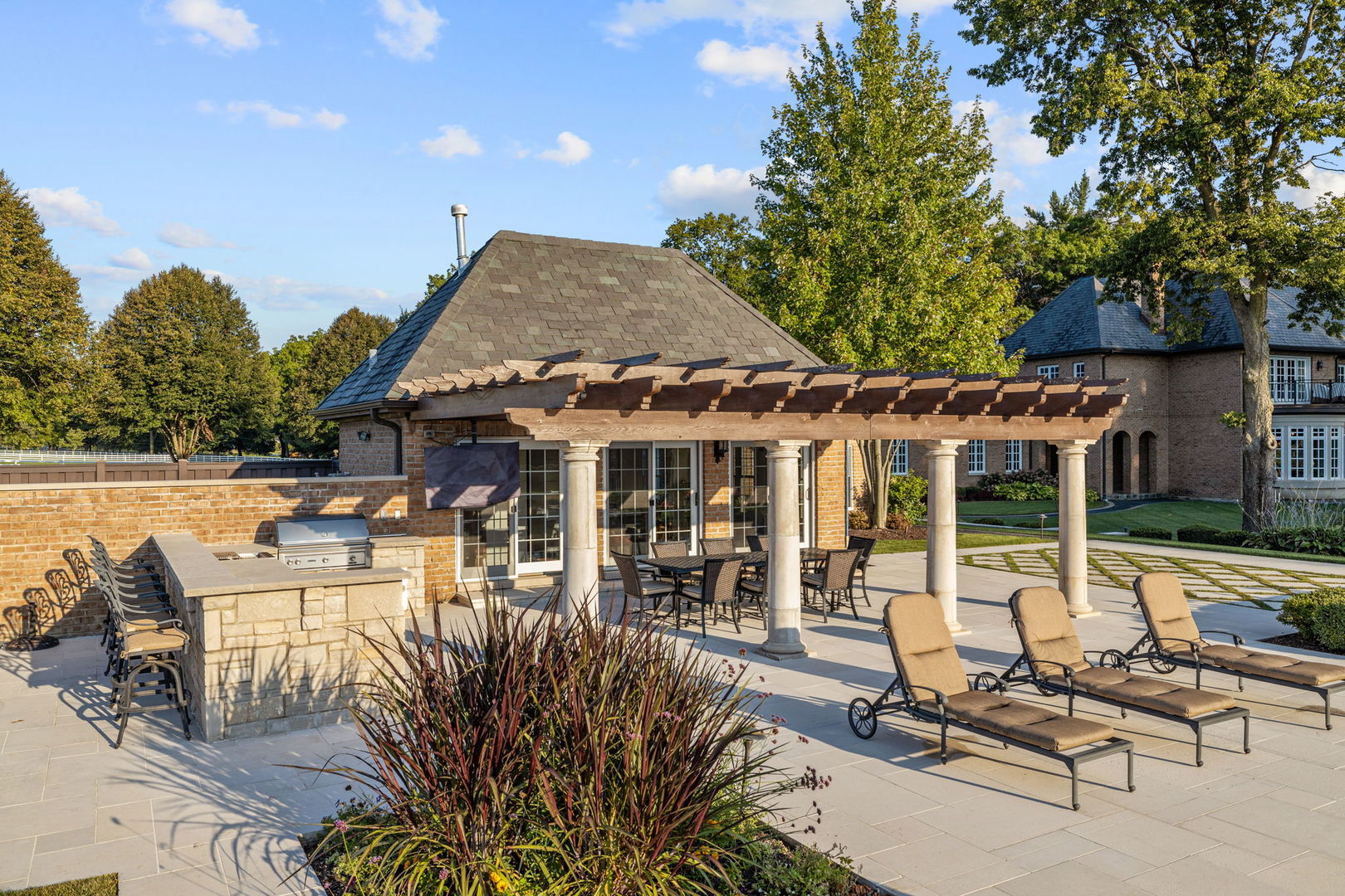 5021 Minkler Road Yorkville, IL 60560 - Photo 72 of 92 a view of a patio with table and chairs potted plants and large tree
