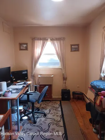 a workspace with furniture and a window