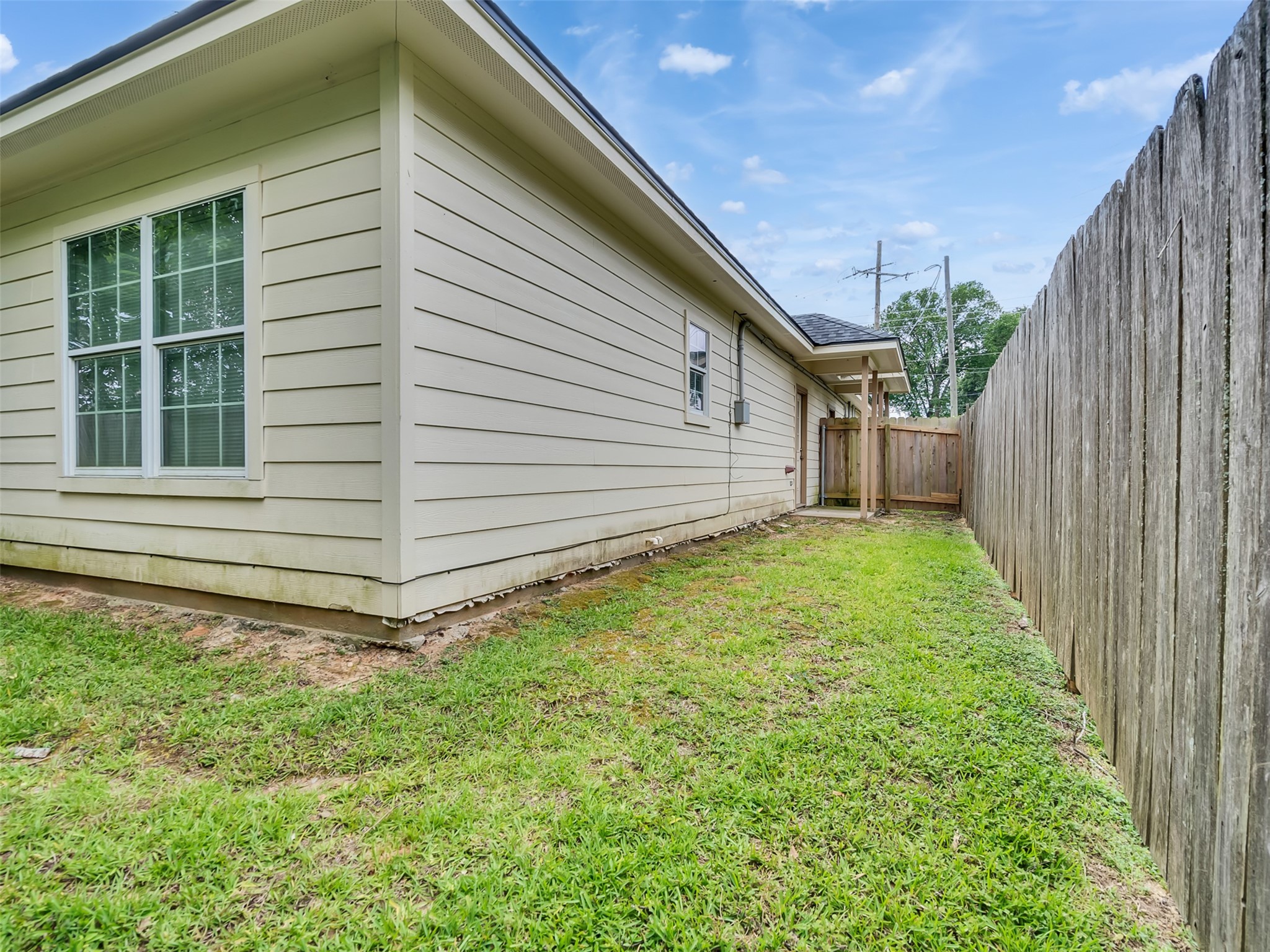104 Longstreet Road, Unit 2 Willis, TX 77378 - Photo 25 of 26 a view of a backyard with pathway