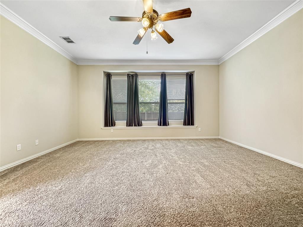 401 Varnum Way Fairview, TX 75069 - Photo 15 of 33 an empty room with chandelier fan and windows