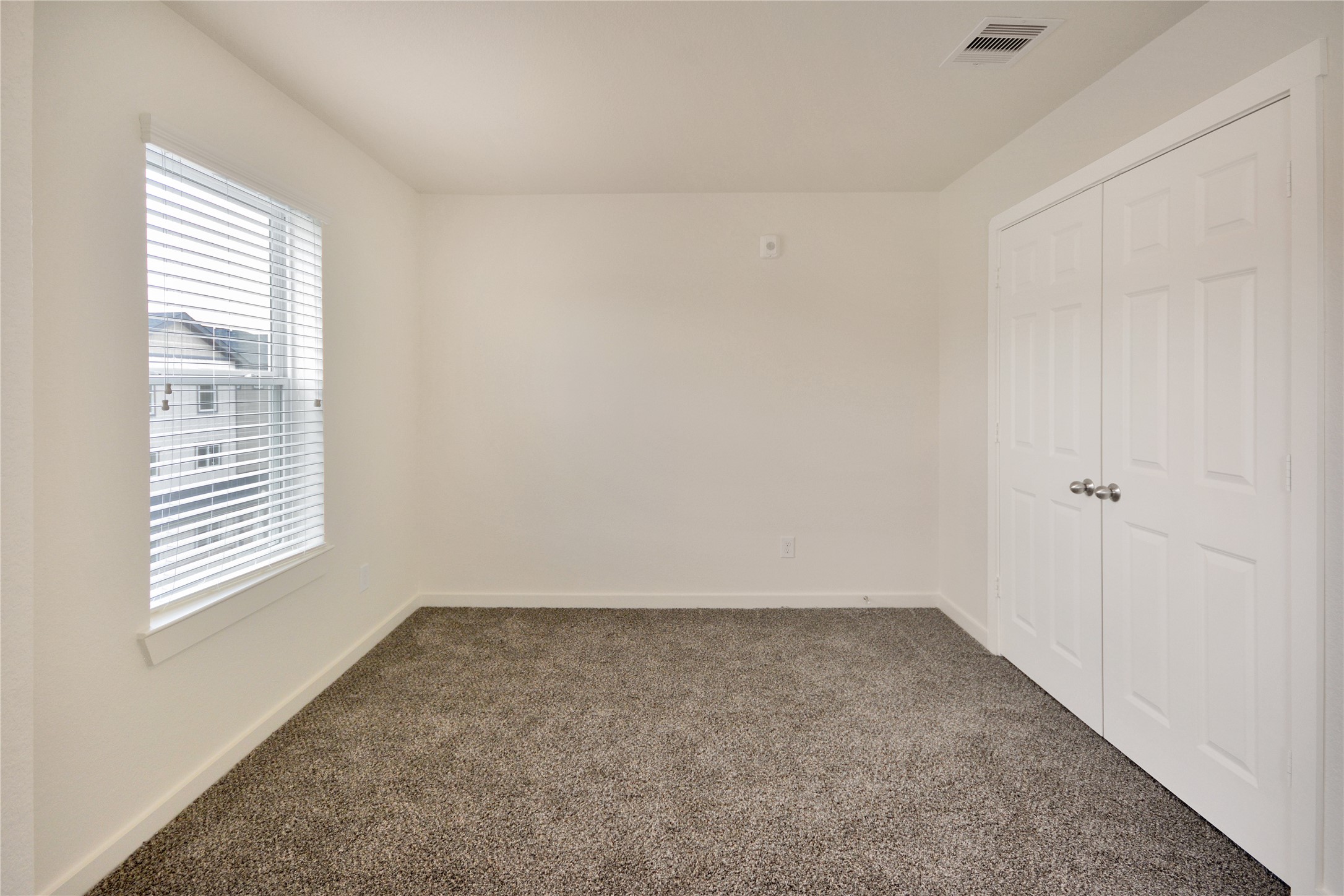 12603 Telge Road, Unit 8EH Cypress, TX 77429 - Photo 22 of 32 an empty room with windows