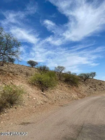 a view of a road with an ocean view