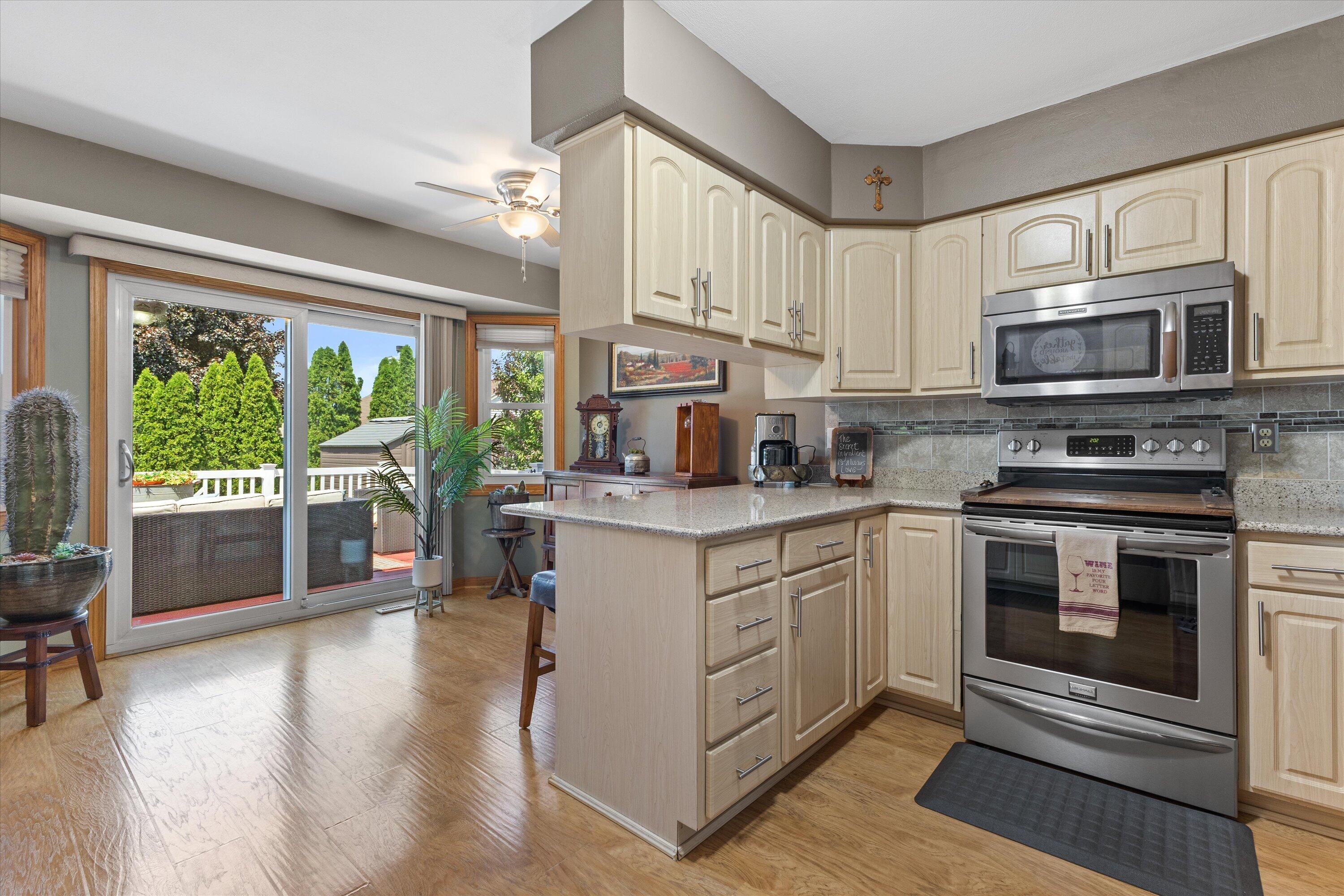 6620 Ranger Drive Mount Pleasant, WI 53406 - Photo 24 of 41 Kitchen and dinette/breakfast nook area. Doors lead to deck.