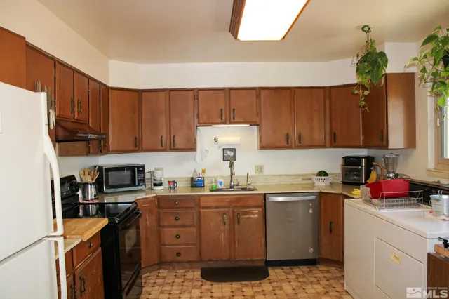 a bedroom with a bed and a potted plant