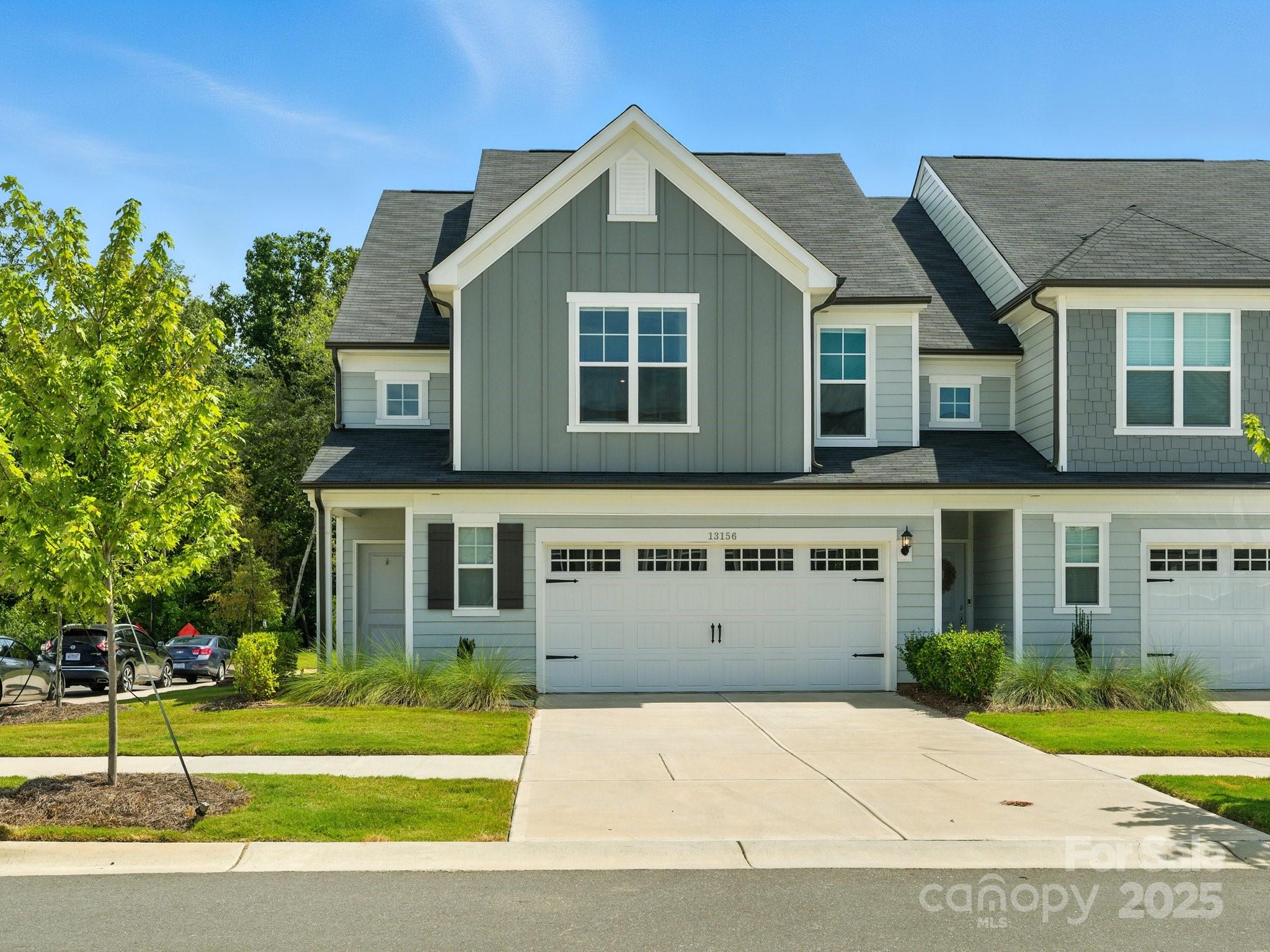 13156 Rover Street Charlotte, NC 28273 - Photo 1 of 37 a front view of a house with a yard