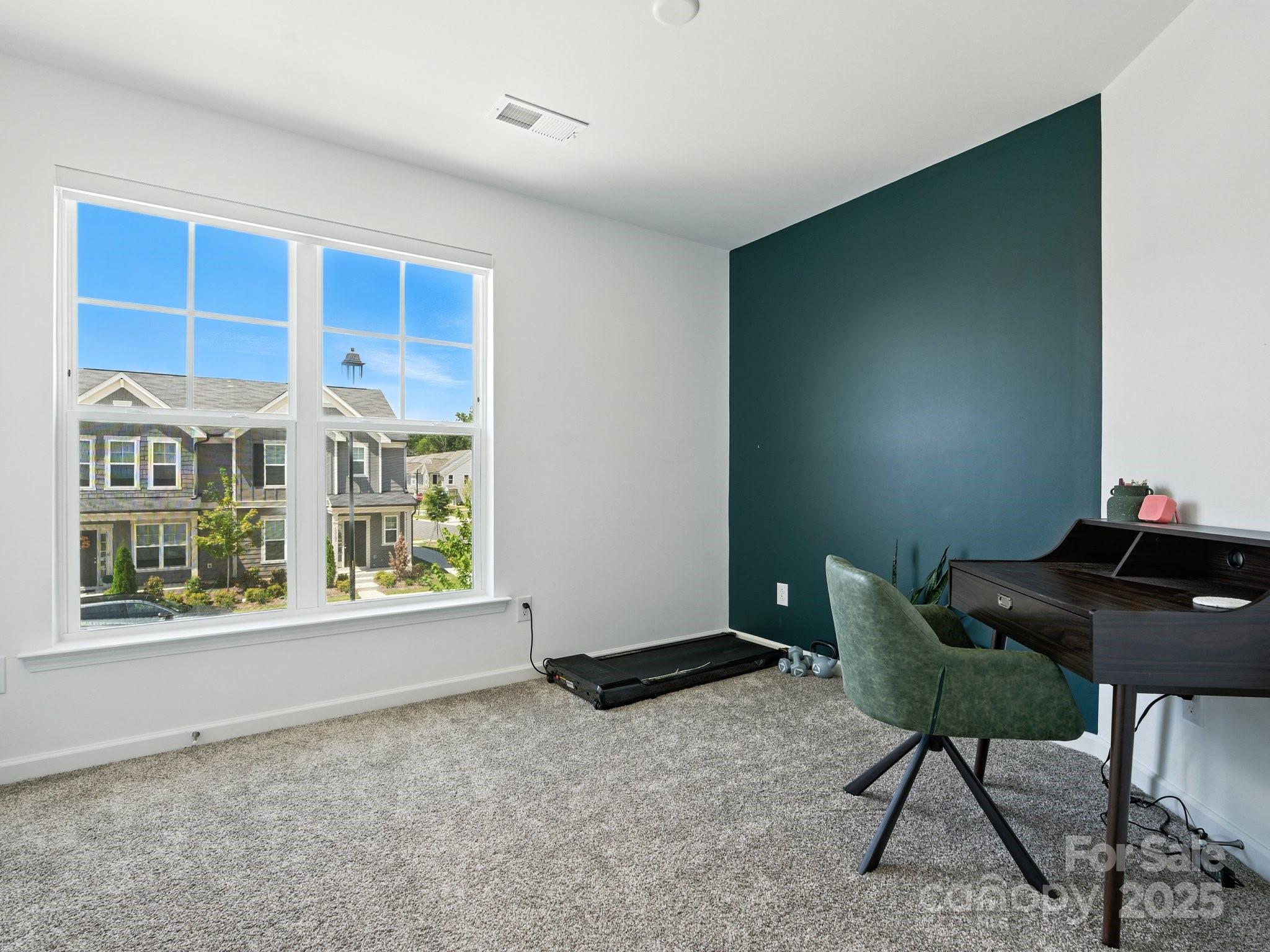 13156 Rover Street Charlotte, NC 28273 - Photo 19 of 37 a living room with furniture and a window