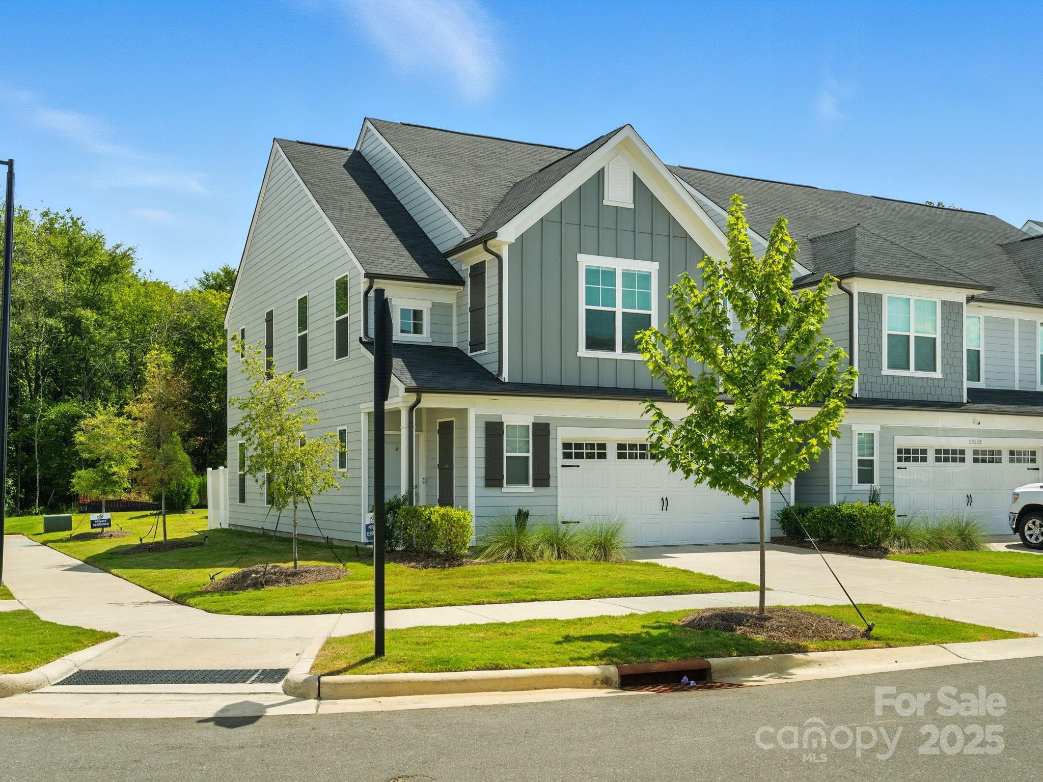 13156 Rover Street Charlotte, NC 28273 - Photo 2 of 37 a front view of a house with a yard