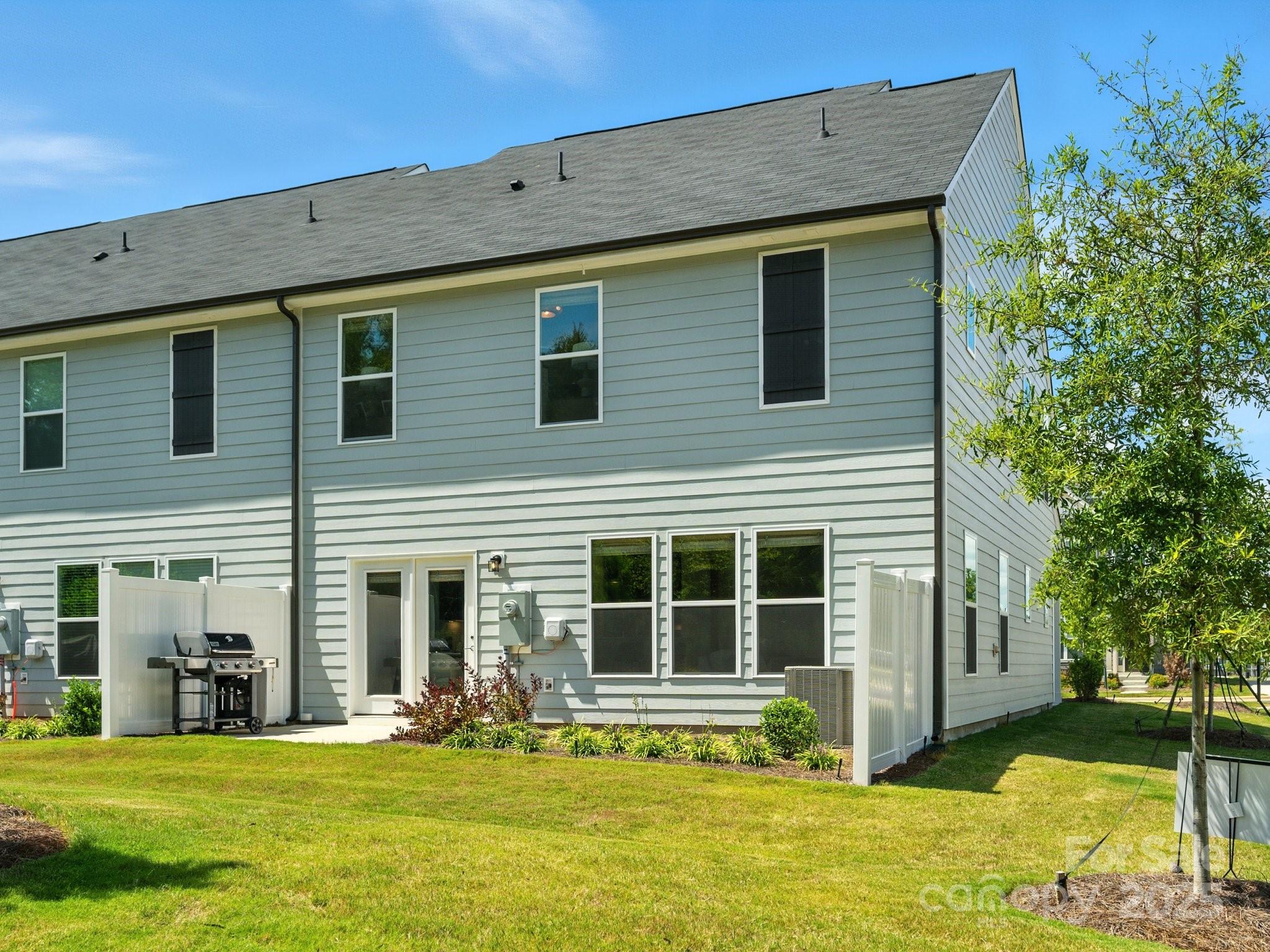 13156 Rover Street Charlotte, NC 28273 - Photo 29 of 37 a front view of a house with a yard