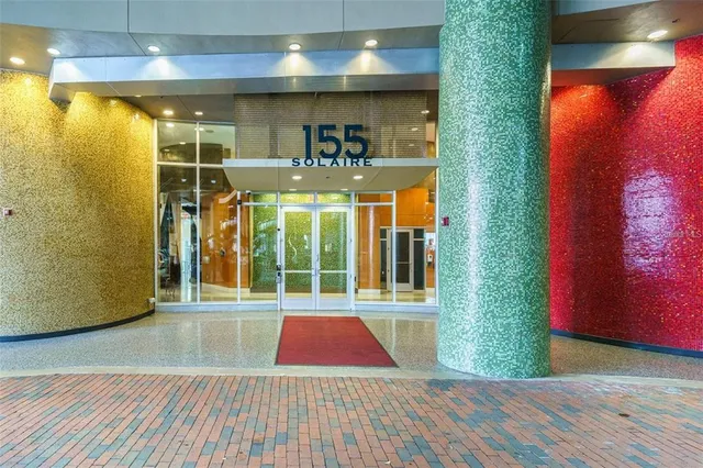 a living room with patio furniture and a window
