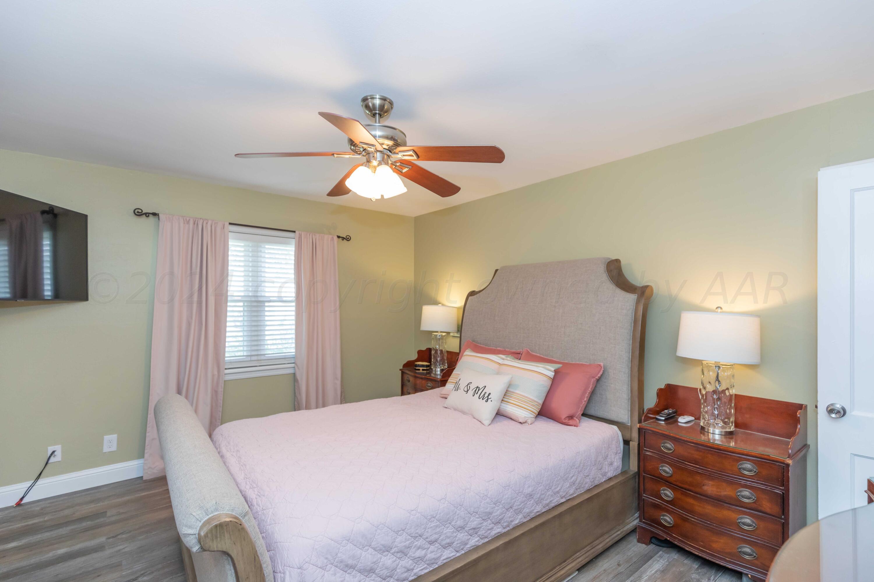 1007 South Alabama Street Amarillo, TX 79102 - Photo 18 of 55 a bedroom with a bed and window