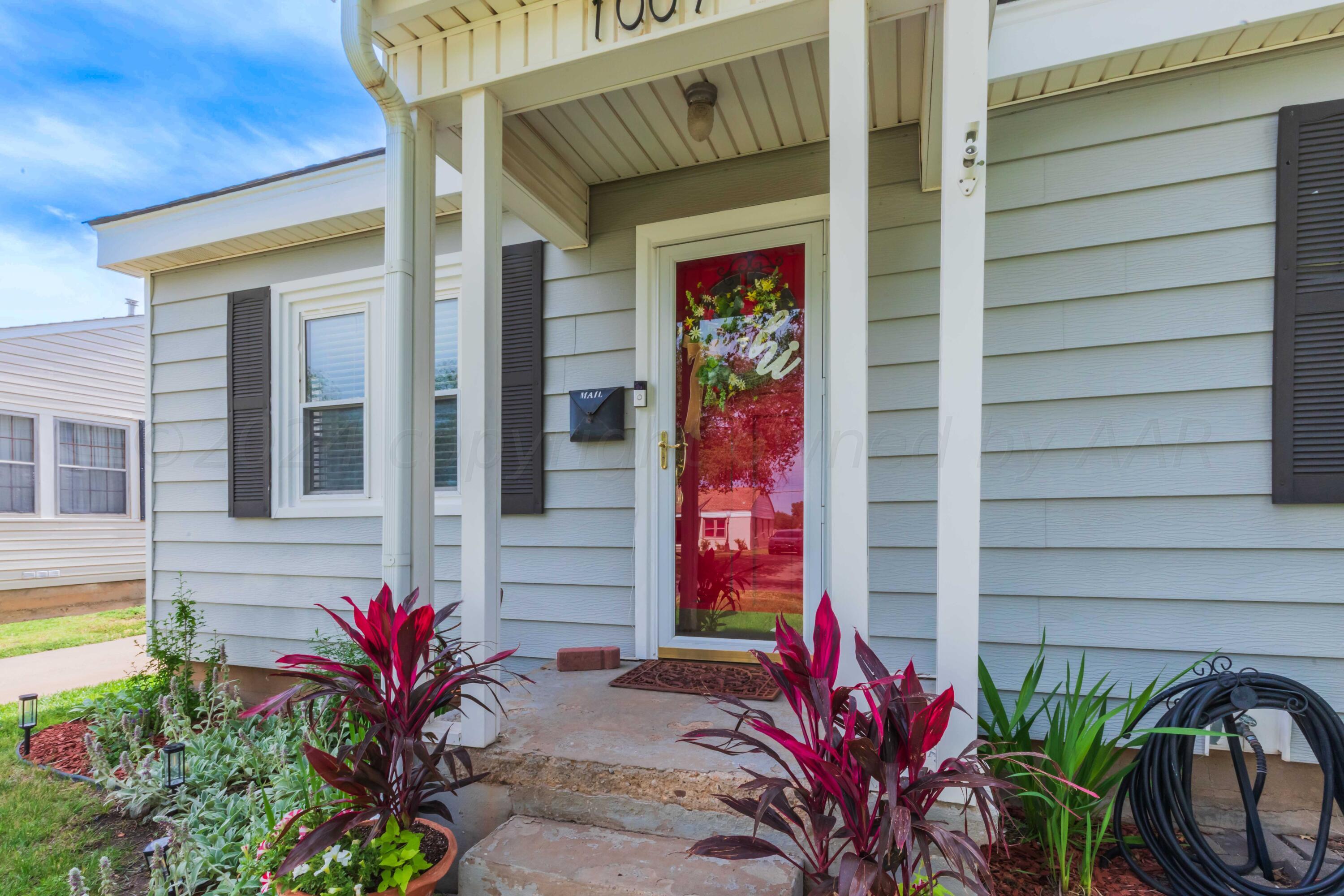 1007 South Alabama Street Amarillo, TX 79102 - Photo 2 of 55 a potted plant sitting in front of a house