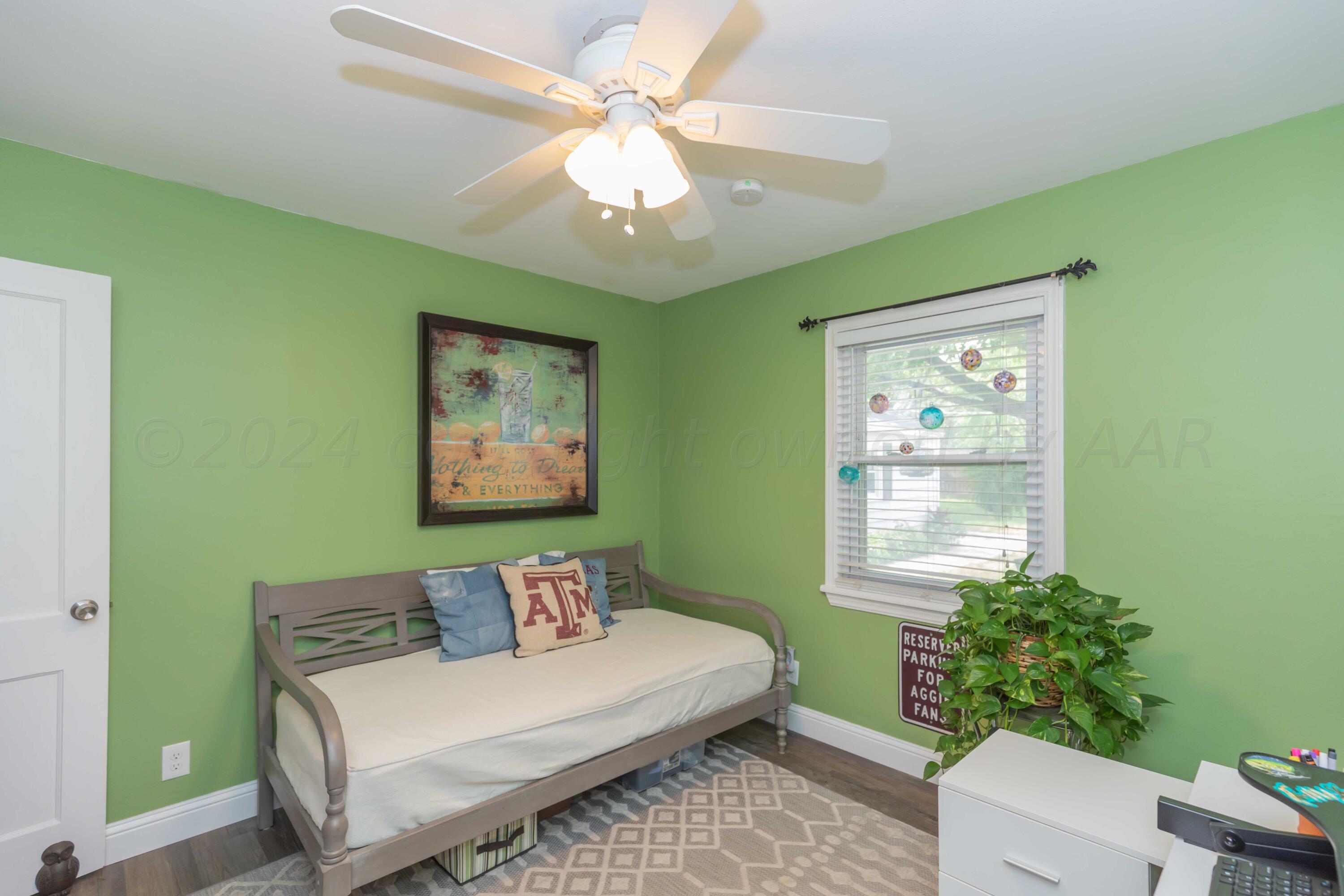 1007 South Alabama Street Amarillo, TX 79102 - Photo 23 of 55 a bedroom with a bed and a window
