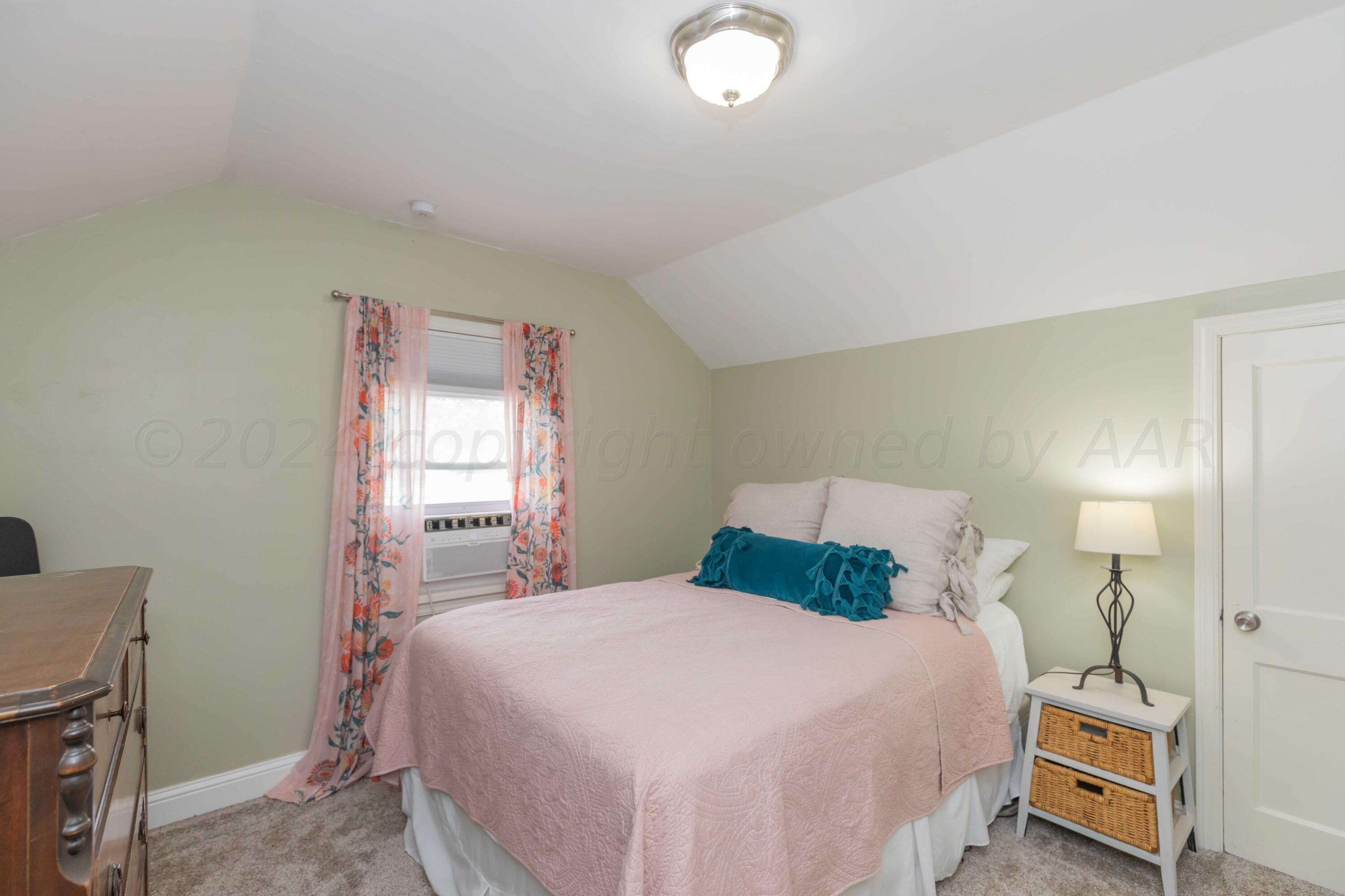 1007 South Alabama Street Amarillo, TX 79102 - Photo 26 of 55 a bedroom with a bed and a window