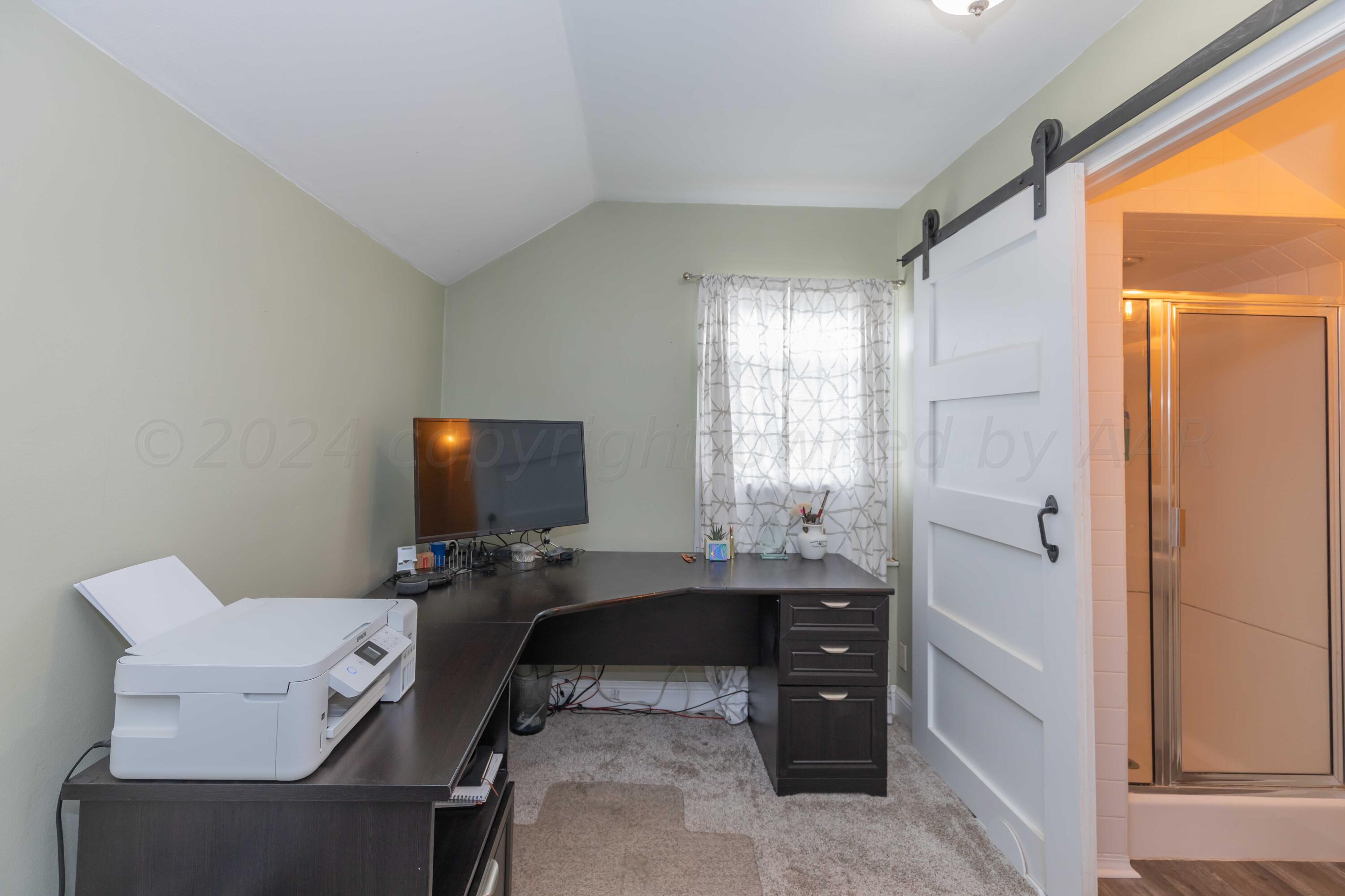 1007 South Alabama Street Amarillo, TX 79102 - Photo 30 of 55 a workspace with furniture and window