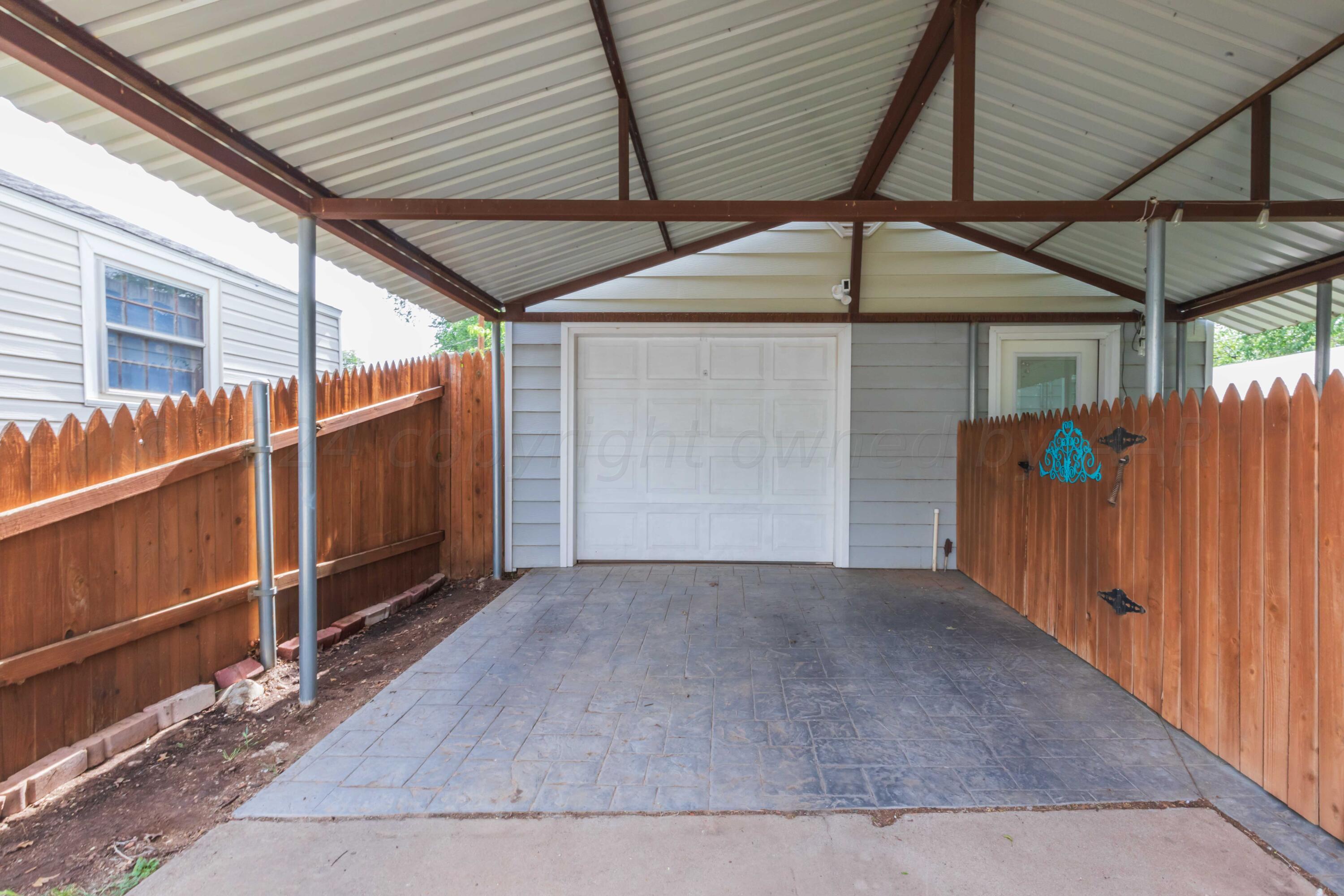 1007 South Alabama Street Amarillo, TX 79102 - Photo 37 of 55 an empty room with wooden floor and windows