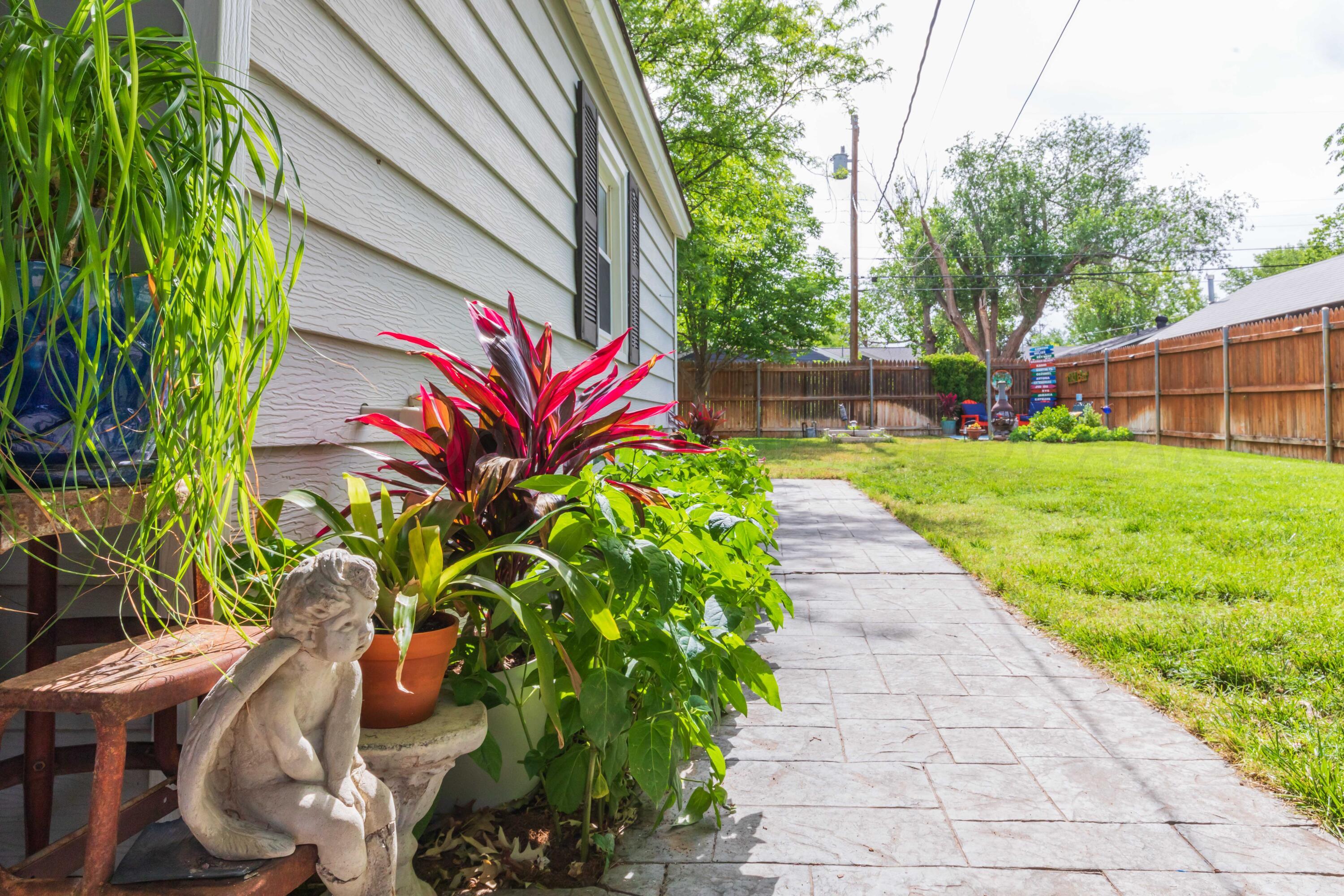 1007 South Alabama Street Amarillo, TX 79102 - Photo 40 of 55 a view of a backyard with potted plants