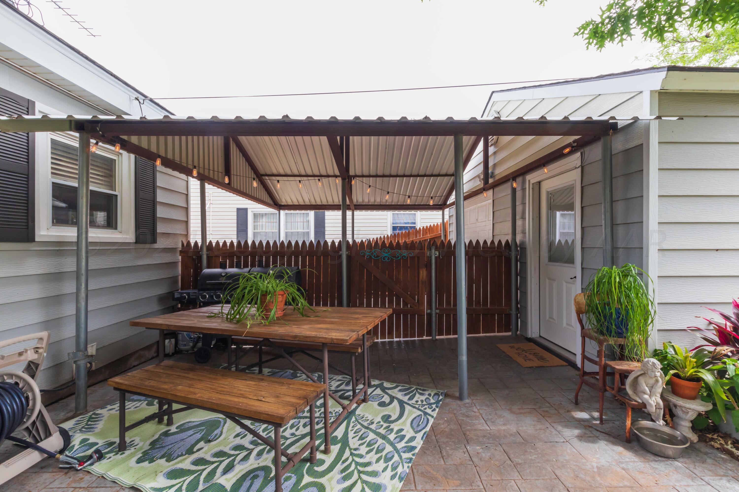 1007 South Alabama Street Amarillo, TX 79102 - Photo 43 of 55 a backyard of a house with table and chairs