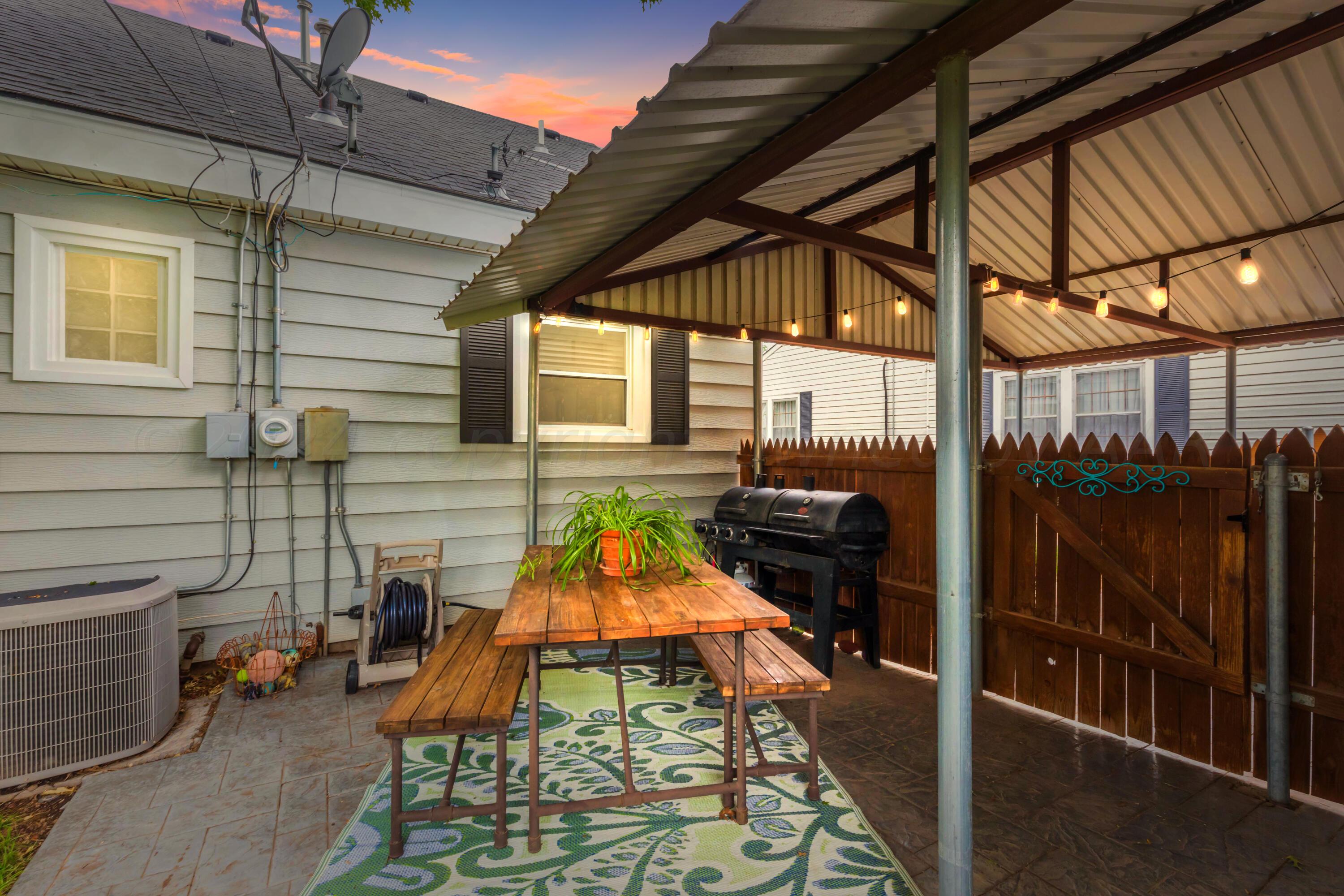 1007 South Alabama Street Amarillo, TX 79102 - Photo 54 of 55 a backyard of a house with barbeque oven table and chairs