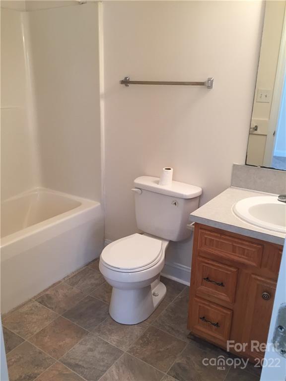 2296 Beth Haven Church Road, Unit 2296 Denver, NC 28037 - Photo 11 of 13 a bathroom with a sink a toilet and bathtub