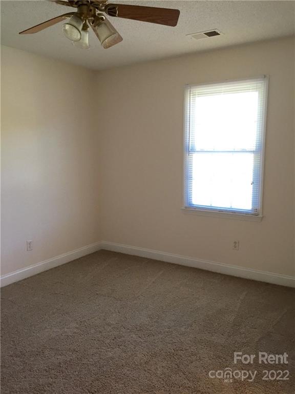 2296 Beth Haven Church Road, Unit 2296 Denver, NC 28037 - Photo 9 of 13 an empty room with a window