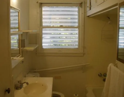 a bathroom with a sink and a shower