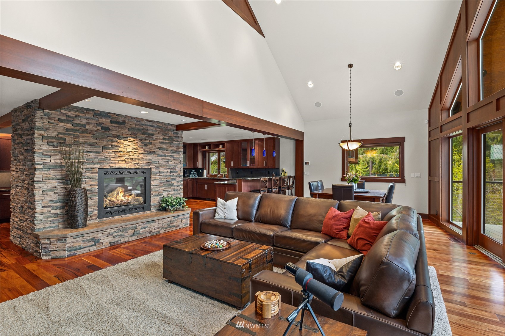 691 Kachess River Road Easton, WA 98925 - Photo 18 of 40 a living room with furniture a large window and a fireplace