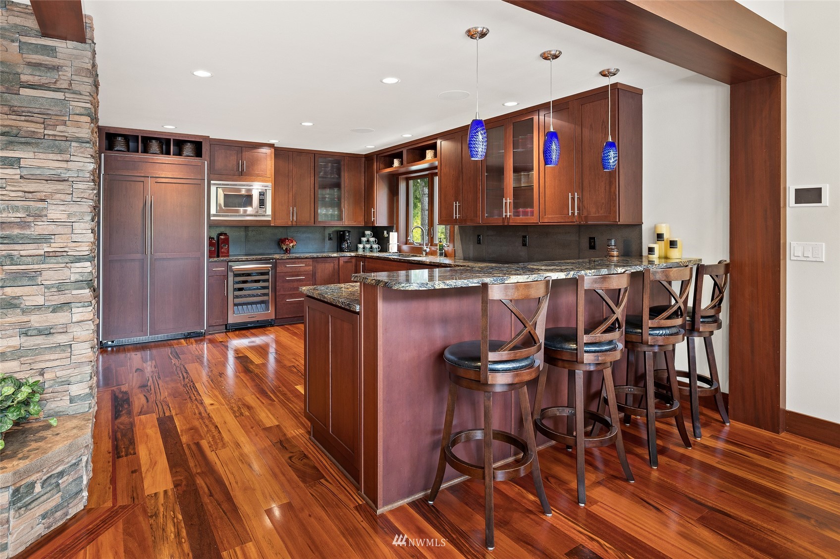 691 Kachess River Road Easton, WA 98925 - Photo 20 of 40 a view of a dining room with furniture and wooden floor