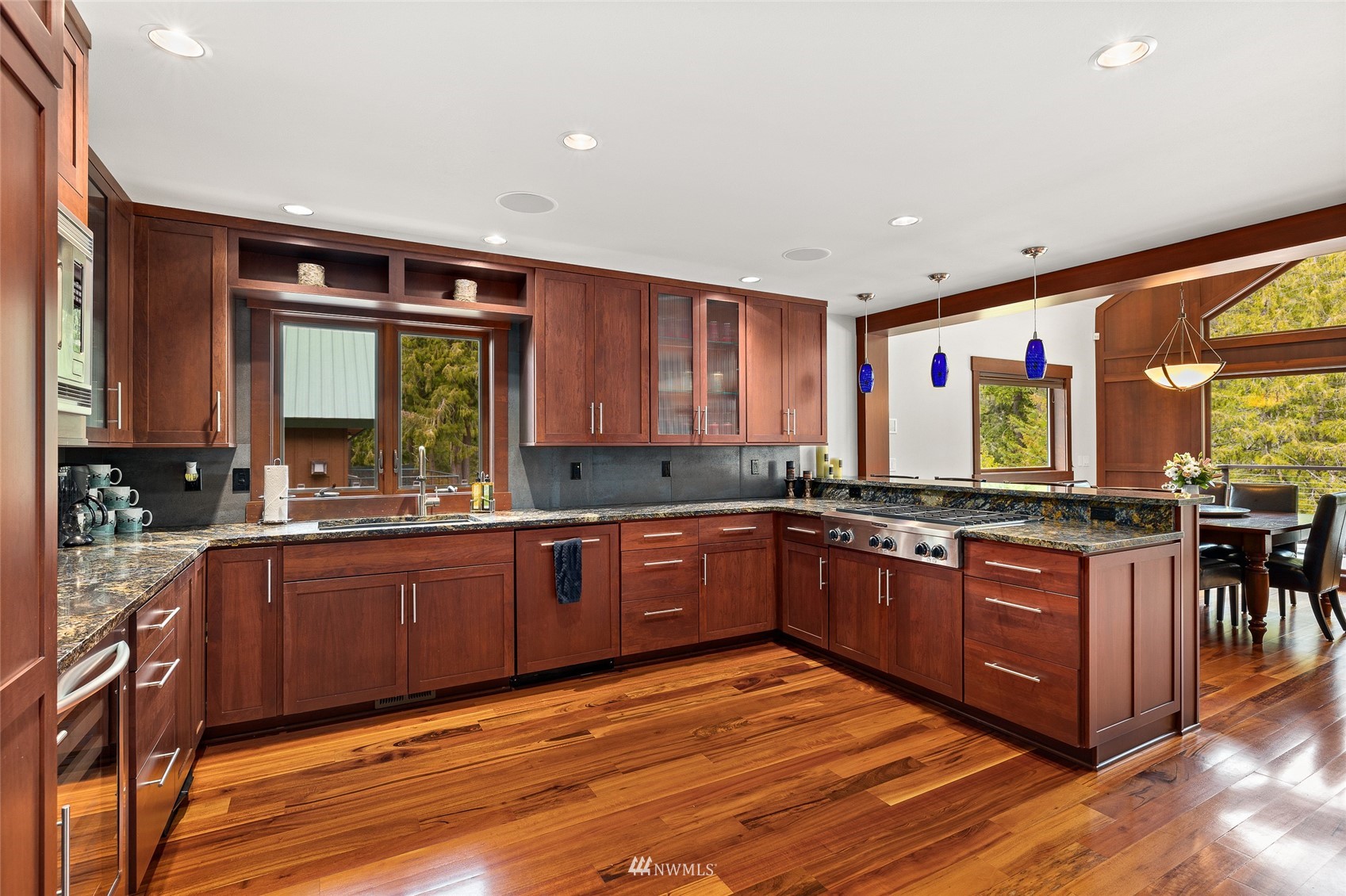 691 Kachess River Road Easton, WA 98925 - Photo 21 of 40 a large kitchen with stainless steel appliances granite countertop wooden cabinets a sink and dishwasher