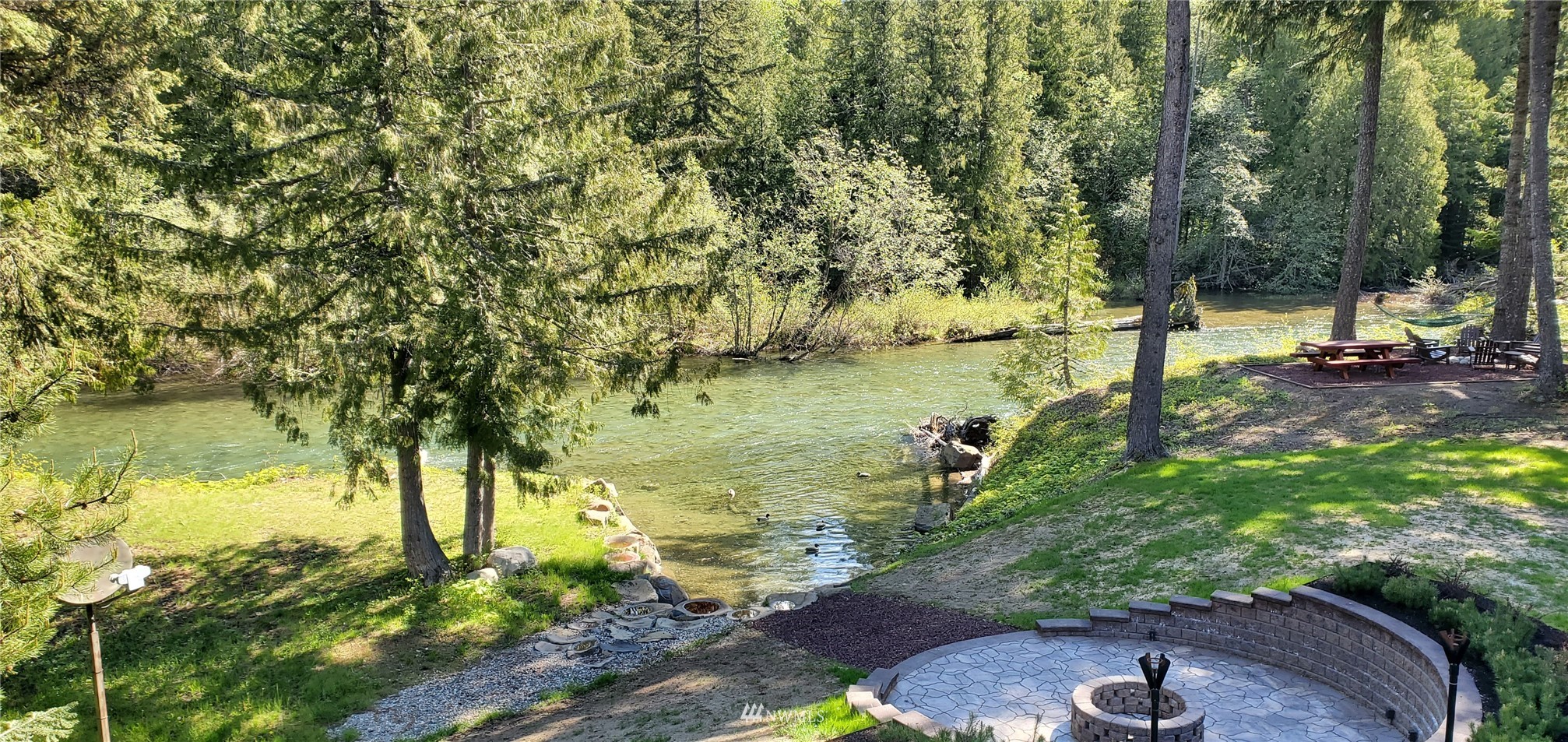 691 Kachess River Road Easton, WA 98925 - Photo 6 of 40 a view of a lake with a yard