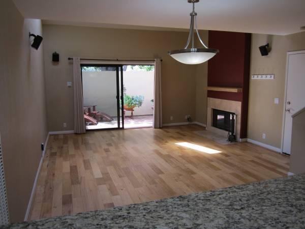 3566 Modoc Road, Unit 36 Santa Barbara, CA 93105 - Photo 13 of 16 a view of a room with furniture wooden floor and a chandelier