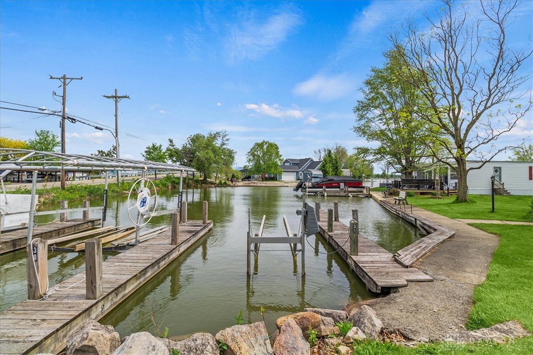 246 North Orchard Island Road Russells Point, OH 43348 - Photo 3 of 43 Boasting a private dock, this canal-front property offers direct water access and picturesque views.
