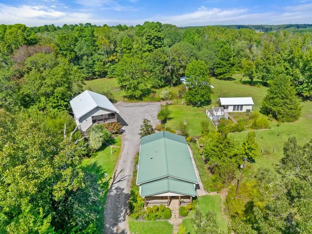 an aerial view of a house with a yard