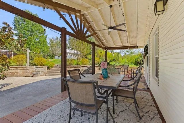 a view of an outdoor dining space with furniture