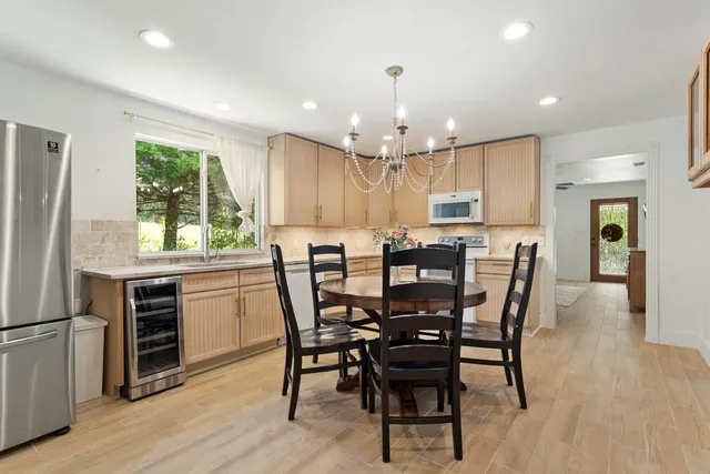 a view of a dining room with furniture and window