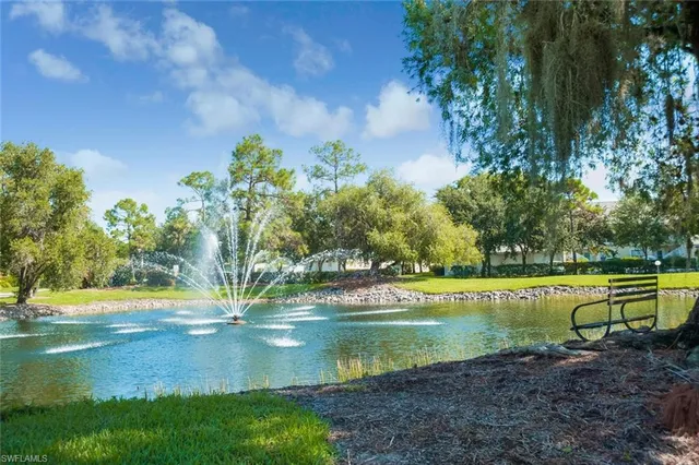 a view of a lake with a yard