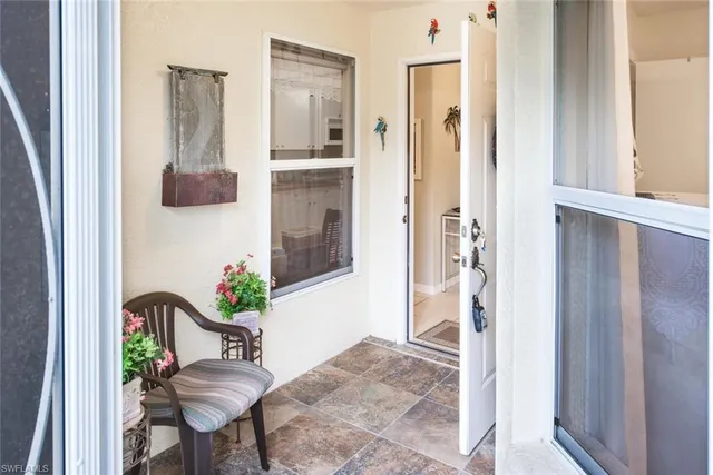a view of entryway with wooden floor and chair