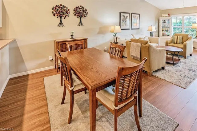 a view of a dining room with furniture and a table