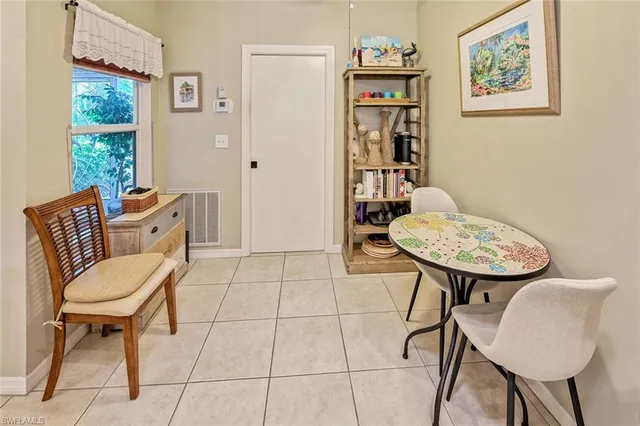 a view of a room with furniture and wooden floor