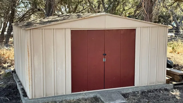 a view of a house with yard and sitting area