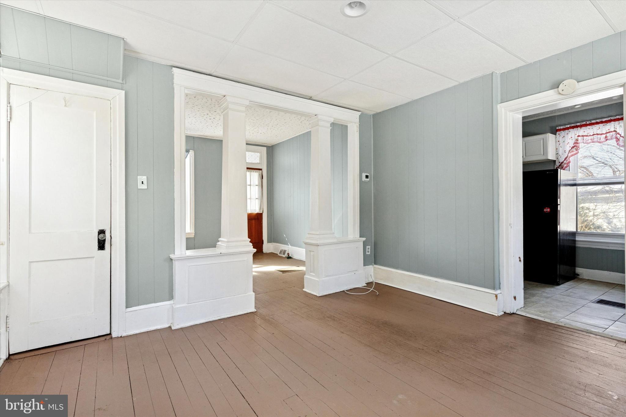 24 East 5th Street Pottstown, PA 19464 - Photo 15 of 15 an empty room with wooden floor and windows