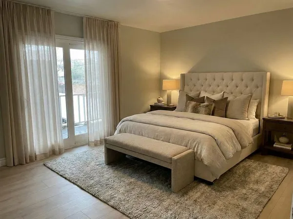 a bedroom with a bed and window