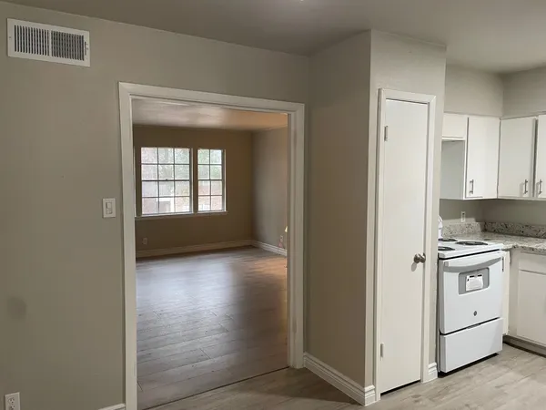 a view of a kitchen with a sink and a stove