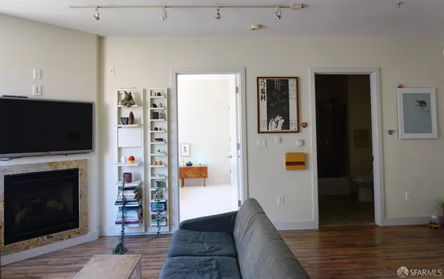 a living room with furniture and a flat screen tv