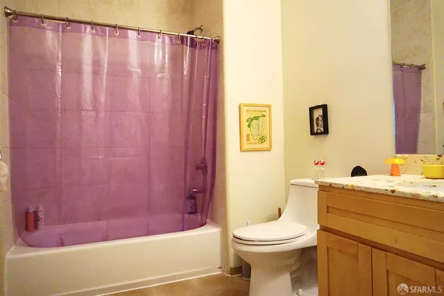 a bathroom with a toilet a sink and bathtub