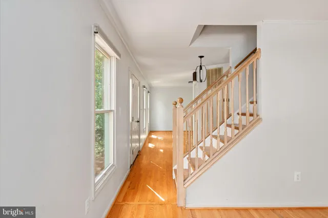 a view of a room with wooden floor and balcony