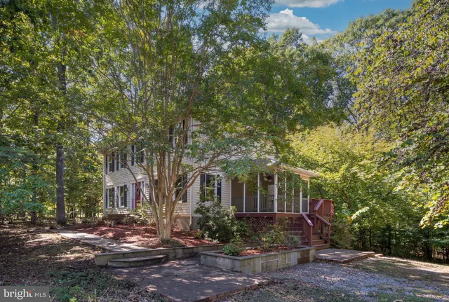 a view of a house with a tree