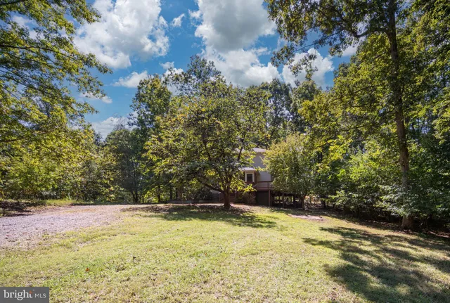 a view of a room with wooden floor and window