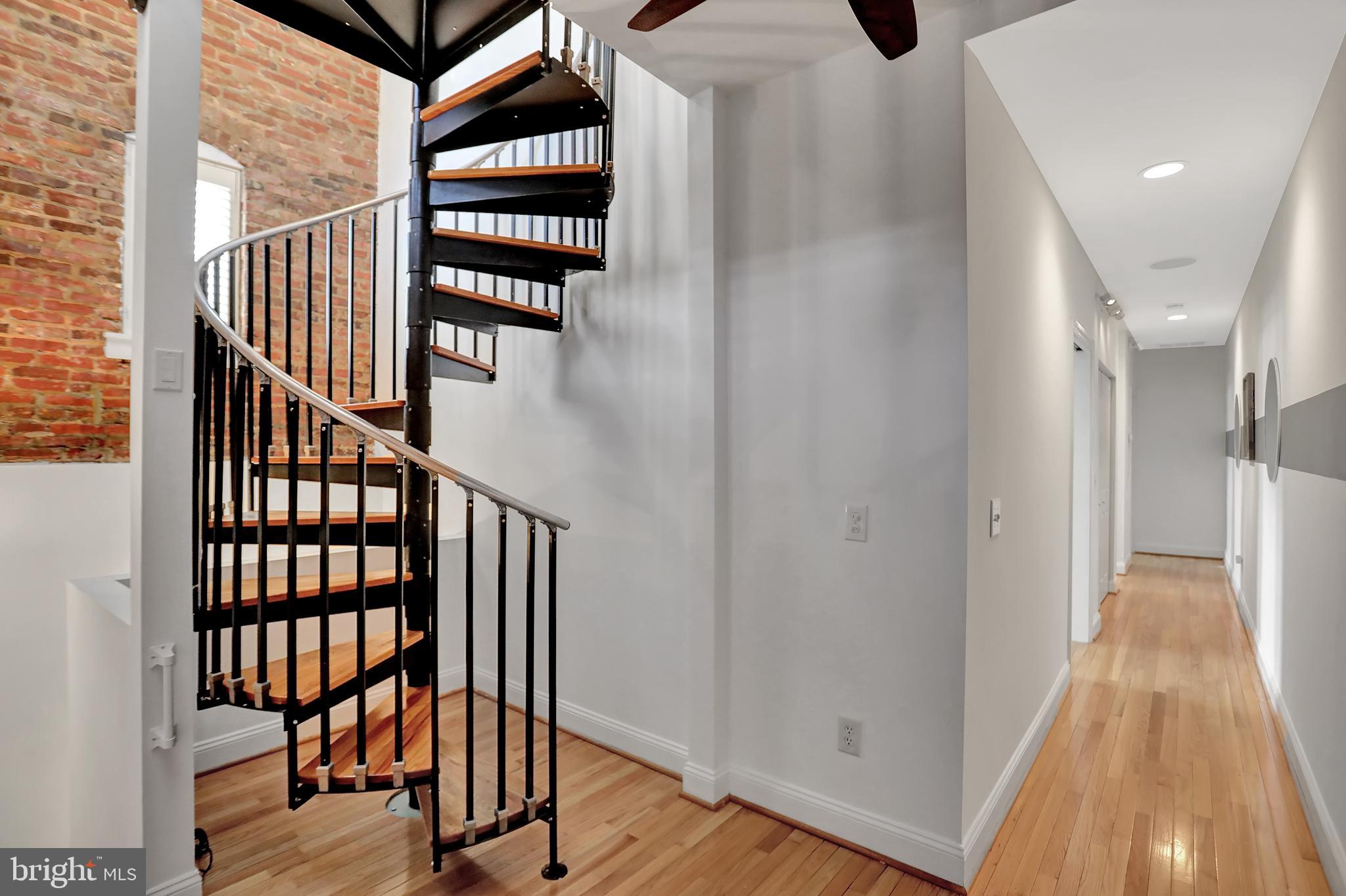 832 Trinity Street Baltimore, MD 21202 - Photo 22 of 60 Tower staircase. upper level landing.