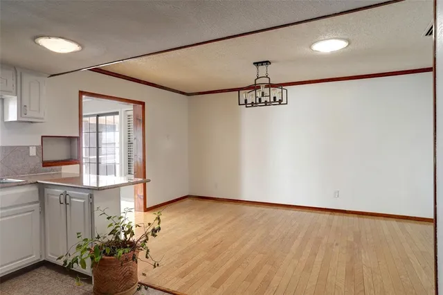 a view of a dining room and kitchen